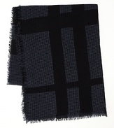 A lightweight scarf with Burberry's iconic check pattern is offset with classic houndstooth for a posh addition to your stylish ensemble.