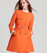 Bring bright, on-trend color to chilly days with this classic collarless trench from Moncler.