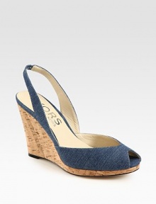 Comfort-minded denim wedge with a stretchy slingback and low-cut upper. Cork wedge, 4 (100mm)Cork platform, 1 (25mm)Compares to a 3 heel (75mm)Denim upperLeather lining and solePadded insoleImported