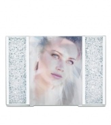 Make your memories shine even brighter with the Starlet picture frame. Thousands of tiny Swarovski crystals and polished metal trim put your photo on dazzling display.