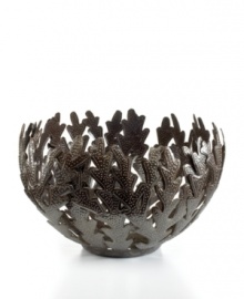 Made entirely of recycled steel, the Coral bowl is intricately cut and hammered by Haitian metal artisans to evoke the life-giving sea that laps their shores. Rich texture in its crisscrossed branches add to the special nature of each handmade piece. Made entirely of recycled steel, the Coral bowl is intricately cut and hammered by Haitian metal artisans to evoke the life-giving sea that laps their shores. Rich texture in its crisscrossed branches add to the special nature of each handmade piece.