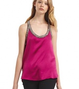 THE LOOKOrnately beaded edgesU necklineSleevelessRacerbackTHE FITAbout 26 from shoulder to hemTHE MATERIALSilkCARE & ORIGINDry cleanMade in USA of imported fabric