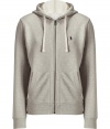 Sporty separates are casual wardrobe essentials, and this Polo Ralph Lauren light grey cotton fleece zip up has enduring appeal - Slim, straight cut - Classic hoodie style, with drawstrings, kangaroo pockets and full zipper - Banded waist and cuffs - Embroidered polo pony logo at chest - Easy and indispensable, perfect for pairing with jeans, chinos, shorts or sweatpants