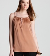 Marrying feminine detail with a warm copper tone, this Vince silk cami tops of casual separates with elegant ease.