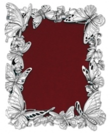 Make fond memories feel as fresh as spring with this silver-plated picture frame from Arthur Court. Sculpted butterflies gather around your favorite photos, turning each into a fanciful nature scene. Make fond memories feel as fresh as spring with this silver-plated picture frame from Arthur Court. Sculpted butterflies gather around your favorite photos, turning each into a fanciful nature scene.