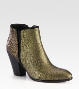 Trend-worthy silhouette of snake-embossed metallic leather with suede trim, a stacked heel and elastic side gores. Stacked heel, 3½ (90mm)Snake-embossed metallic leather upper with suede trim and side elastic goresSide zipLeather lining and solePadded insoleMade in Italy