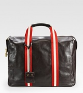 Everything is safe and at-hand in this sturdy calfskin leather design, crafted for a lifetime of use and wear. Cotton webbing adds color to the sides and extends to the handles. Double top handles Zip closure Interior organizational pocket Lined in cotton 15½W X 11½H X 4D Imported