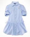 A classic, essential cotton oxford shirtdress is finished with iconic embroidery and a drawstring waist for a preppy look.