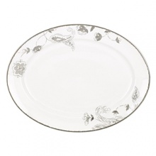 A soft floral motif exquisitely adorns Lenox's Paisley Terrace white-bodied porcelain oval platter. Mica accents and gleaming platinum trim complete the traditional-modern look. A soft floral motif exquisitely adorns Lenox's Paisley Terrace white-bodied porcelain oval platter. Mica accents and gleaming platinum trim complete the traditional-modern look.