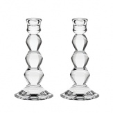 Inspired by modern architectural elements and the faceted gems of the designer's jewelry, Vera Wang's Orient, these luminous Vera Wang candlesticks lend timeless grandeur to your table.