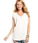 Neutral tones and muted embellishments make this sleeveless One Clothing top the perfect match for a pair of fun skinnies!