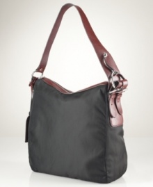 A laid-back silhouette gets an elegant upgrade with this haute hobo from Lauren Ralph Lauren. Sleek, durable nylon with equestrian-inspired stirrup hardware exudes functional style, while the rich leather accents add instant polish and sophistication.