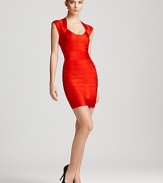 A body-con French Connection bandage dress, complete with a silver exposed back zipper, turns heads upon entry and exit. Sleek pumps punctuate the dramatic look with edge.