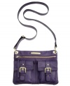 Perfectly portable, this compact crossbody from Franco Sarto will take you from a Saturday night in the city to a Sunday brunch in the burbs. Signature golden hardware and buckle and stud accents add interest to the exterior, while the adjustable strap keeps hands free to access all your essentials.