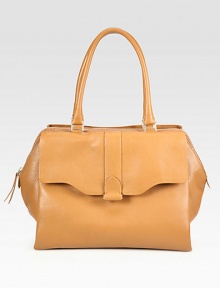 Luxurious deer leather in a roomy carryall, perfectly sized for all your essentials.Double shoulder strap, 8½ dropTop zip closureProtective metal feetOne outside flap pocketOne outside open pocketTwo inside open pocketsSatin lining13½W X 11H X 5DMade in Italy