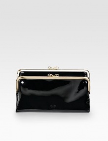 Much more room inside than you'd expect in a clutch, with a high-shine finish in gorgeous patent leather.Kiss-lock closure One inside zip pocket, two bill slots, six credit card slots Fully lined 8½W X 5H X 1D Imported