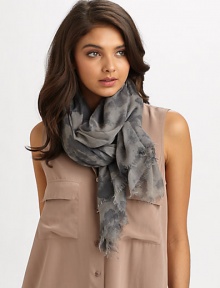 This hand-dyed splatter print is accented with a sweet baby fringe. ModalAbout 72 X 52Dry cleanImported