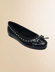 Spectator detailing on a patent flat sharpened with silvery studs.Elasticized grosgrain ribbon opening for great fitStudded bowFaux patent leather upperFlexible constructionSoft microfiber liningPadded insoleRubber soleImportedPlease note: Strap on sizes 8-13 