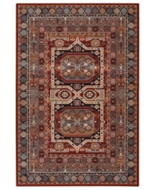 A variety of intricate symmetrical patterns in a bold red and dark blue colorway create a captivating focal point for any space in this area rug from Couristan. Crafted of pure New Zealand wool for long-lasting strength and beauty.