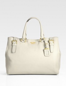 Deerskin leather shopper with buckle details and a removable luggage tag.Double top handles, 7 drop Top snap closure Protective metal feet Two inside zip pockets Two cell-phone pockets Lambskin leather lining 16W X 13H X 5½D Made in Italy