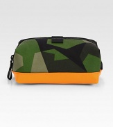 If Rambo ever needed a dopp kit for his moisterizing regime, this is it. Water resistant inside and out, this geometric camo travel kit is dipped in laytex for added durability.Zip closureNylon4W X 10H X 5DImported