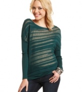 Sheer, asymmetrical stripes soar across the bodice of Jessica Simpson's irresistible pullover sweater.