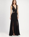 A long, alluring design accented with sheer lace insets and deep front slits.Deep V necklineLace insets at neckline and waist, front and backFlared skirt with front slitsConcealed back zipperAbout 45¼ from shoulder to hem94% polyester/6% spandexDry cleanImportedModel shown is 5'9½ (176cm) wearing US size 2. 