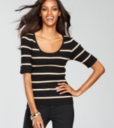A scoopneck sweater from INC gets the glam treatment with metallic stripes and rhinestone buttons at the sleeves!