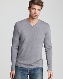 A soft, sleek sweater from Elie Tahari in fine merino wool. Contrast stripes along inner sleeves and sides. A soft, sleek sweater from Elie Tahari in fine merino wool. Contrast stripes along inner sleeves and sides.
