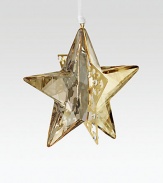 Modern and elegant, this glowing 3D design cleverly combines faceted golden crystal with pierced goldtone metal in an eye-catching ornament on a white satin ribbon.CrystalGoldtoneAbout 2.25H X 2.25WMade in Austria
