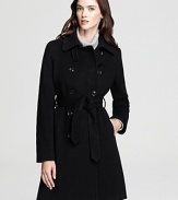 This belted DKNY trench coat gets an update from elegant seaming detail for a modern look to meet the new season.