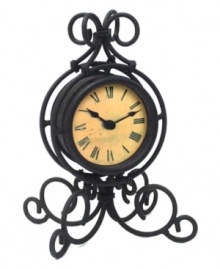 Wrought iron is elegantly twisted around this timepiece, gracing your tabletop with traditional grandeur. With an antique dial and bold Roman numerals, this clock evokes another time and place. Wrought iron is elegantly twisted around this timepiece, gracing your tabletop with traditional grandeur. With an antique dial and bold Roman numerals, this clock evokes another time and place.
