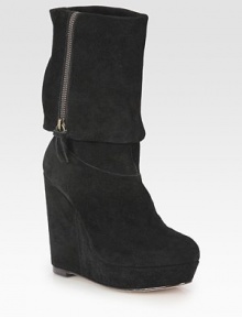 An urban-cool suede design with an exposed zipper, foldover shape and commanding wedge. Self-covered wedge, 5 (125mm)Covered platform, 1¼ (30mm)Compares to a 3¾ heel (95mm)Shaft, 8Leg circumference, 12Suede upperSide zipLeather solePadded insoleImported