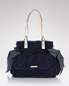 For the it girl who dreams of designer denim, Juicy Couture's bow-trimmed tote is a versatile vision. Roomy enough for the essentials, it makes your favorite fabric feel fresh.