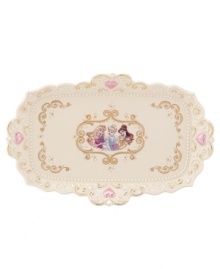 Accent your bedroom or bath with a vanity tray fit for a princess. Cinderella's pumpkin coach adorns ivory porcelain with gold swirls, twinkling stars and pretty pink hearts. A scalloped edge and raised beading refine the ultra-feminine Disney piece. Qualifies for Rebate
