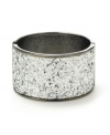 Shimmering and stunning. A silver glitter finish adds a glamorous touch to Haskell's wide bangle bracelet. Crafted in hematite tone mixed metal with a hinge closure. Approximate length: 7-1/2 inches.