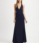 Sexy and chic, tailored with a blouson bodice and accented with a metal ring neck.Plunging halter necklineBeaded bustEmpire waistShirred sideSide slitFully linedConcealed side zipAbout 44½ from natural waist95% polyester/5% spandexDry cleanImportedModel shown is 5'10 (177cm) wearing US size 4. 