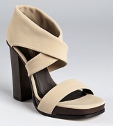 Stretchy matte fabric makes a modern-minimalist statement on Calvin Klein Collection's Fiana sandals.