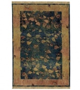 Marked by intriguing visual texture and saturated color, this rug features a pattern of burnished gold leaves that seem to break through a gauzy emerald background. A floating gold border perfectly frames the rug's dynamic beauty. Weathered details impart a timeworn, vintage look.