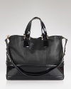 Upgrade wardrobe staples with Z Spoke Zac Posen's leather tote. Designed to meet daytime demands, this bag shines with tailored separates and a take-charge attitude.