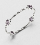 From the Renaissance Collection. Softly hued ovals of faceted amethyst are dotted along a classic twisted cable of sterling silver in this pretty bangle.AmethystSterling silverDiameter, about 2.25Slip-on styleImported