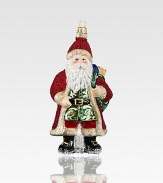 A gorgeously detailed vintage Santa wears rich robes with glitter, beaded textures and intricate patterns, all crafted of mouth-blown, hand-painted glass, an exquisite heirloom for your tree.Glass6.5H X 3W X 2.5DImported