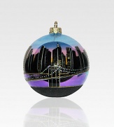This hand-painted keepsake captures the magic of the Manhattan skyline, with its million sparkling lights and sky-scraping spires! Polonaise hand-blown glass About 4 in diameter Made in Poland