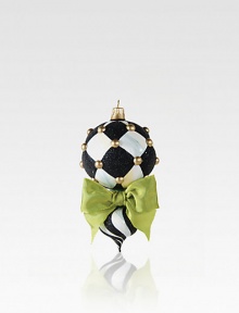A charming, mouthblown glass ornament is destined for many Christmases to come in handpainted chevrons of ivory and onyx. Glass6 longWipe cleanImported