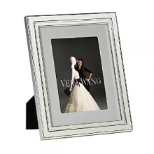 The Vera Wang Chime silver-plated frame collection pulls inspiration from the popular Vera Wang flatware pattern. The frames include a pale gray grosgrain ribbon fabric mat, adding elegance and refinement to any photograph. The Vera Wang Chime silver-plated frame collection pulls inspiration from the popular Vera Wang flatware pattern. The frames include a pale gray grosgrain ribbon fabric mat, adding elegance and refinement to any photograph.