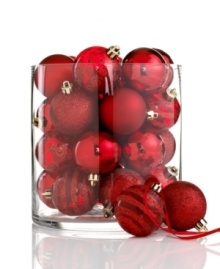 A favorite from one year to the next, Kurt Adler's shatterproof ball ornaments mix stripes and swirls of glitter with matte and shiny finishes, all in festive holiday red. A favorite from one year to the next, Kurt Adler's shatterproof ball ornaments mix stripes and swirls of glitter with matte and shiny finishes, all in festive holiday red.