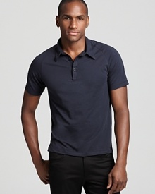 With subtle 1970s styling and a body-hugging slim fit a jersey polo shirt from Theory gets a dose of retro-centric sophistication.