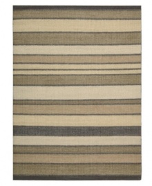 Variegated striping gives way to understated sophistication in the Horizon area rug from Calvin Klein. Generously thick wool fibers are hand tufted in India for remarkable strength and detailed design.