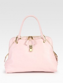 A chic and feminine style in supple leather with shiny, pyramid stud accents.Double top handles, 6½ dropTop zip closureTwo outside open pocketsOne inside zip pocketOne inside open pocketSuede lining16W X 11½H X 5DMade in Italy