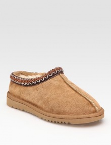 Stay cozy in a this classic suede style with plush shearling lining and embroidered details. Stretch suede upper Shearling lining Foam sole Padded insole Imported Stay cozy in a this classic suede style with plush shearling lining and embroidered details. Stretch suede upper Shearling lining Foam sole Padded insole Imported